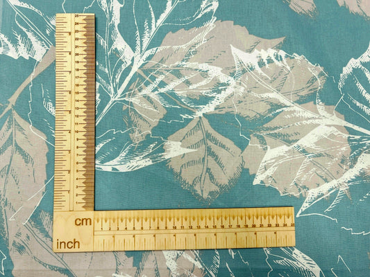 100% Cotton fabric - leaf motif on a turquoise background 220cm 146 g/m²