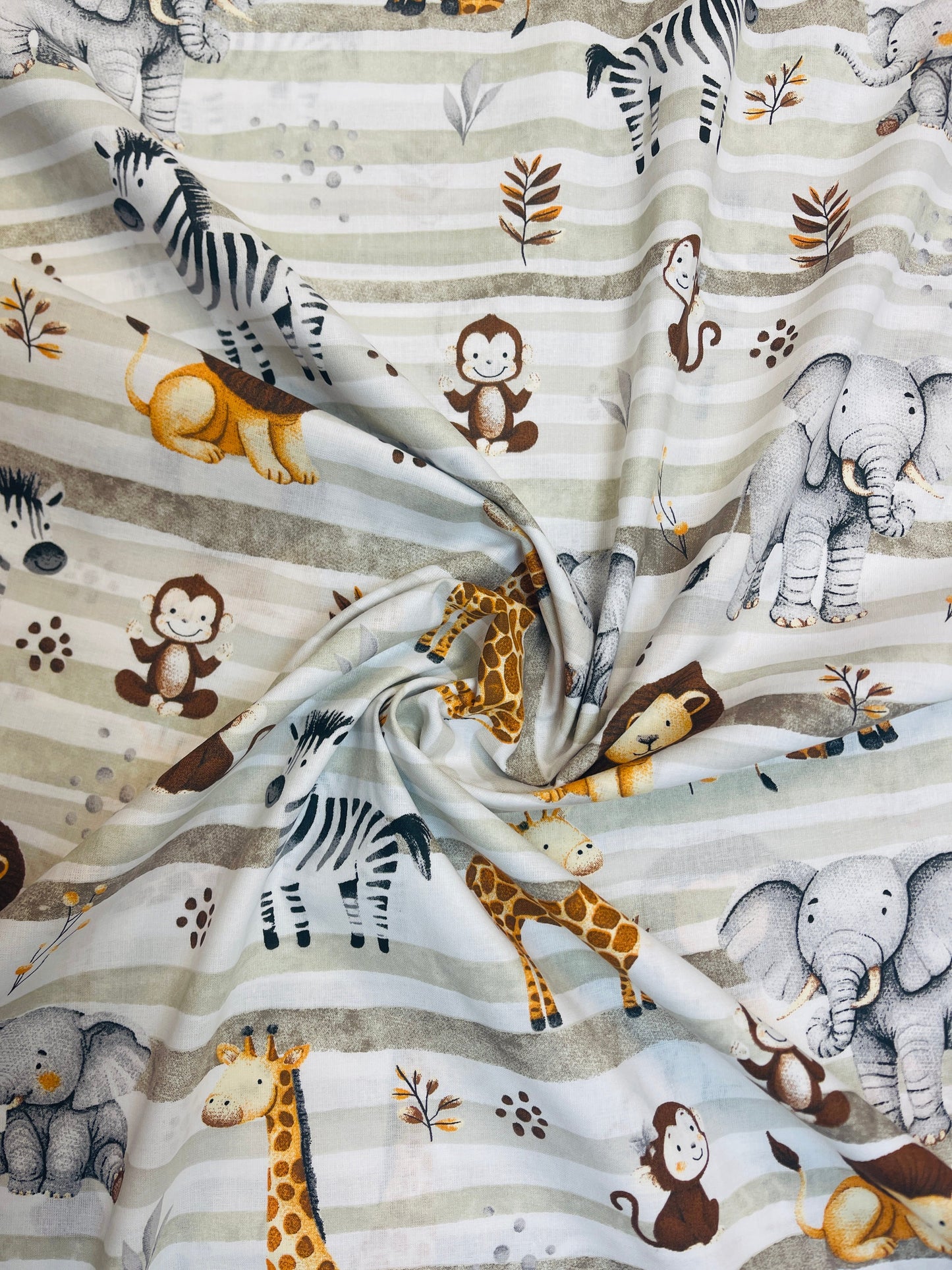 Image with 100% cotton fabric - safari animals and green stripes 125 g/m – available at Šarlotes Audumi