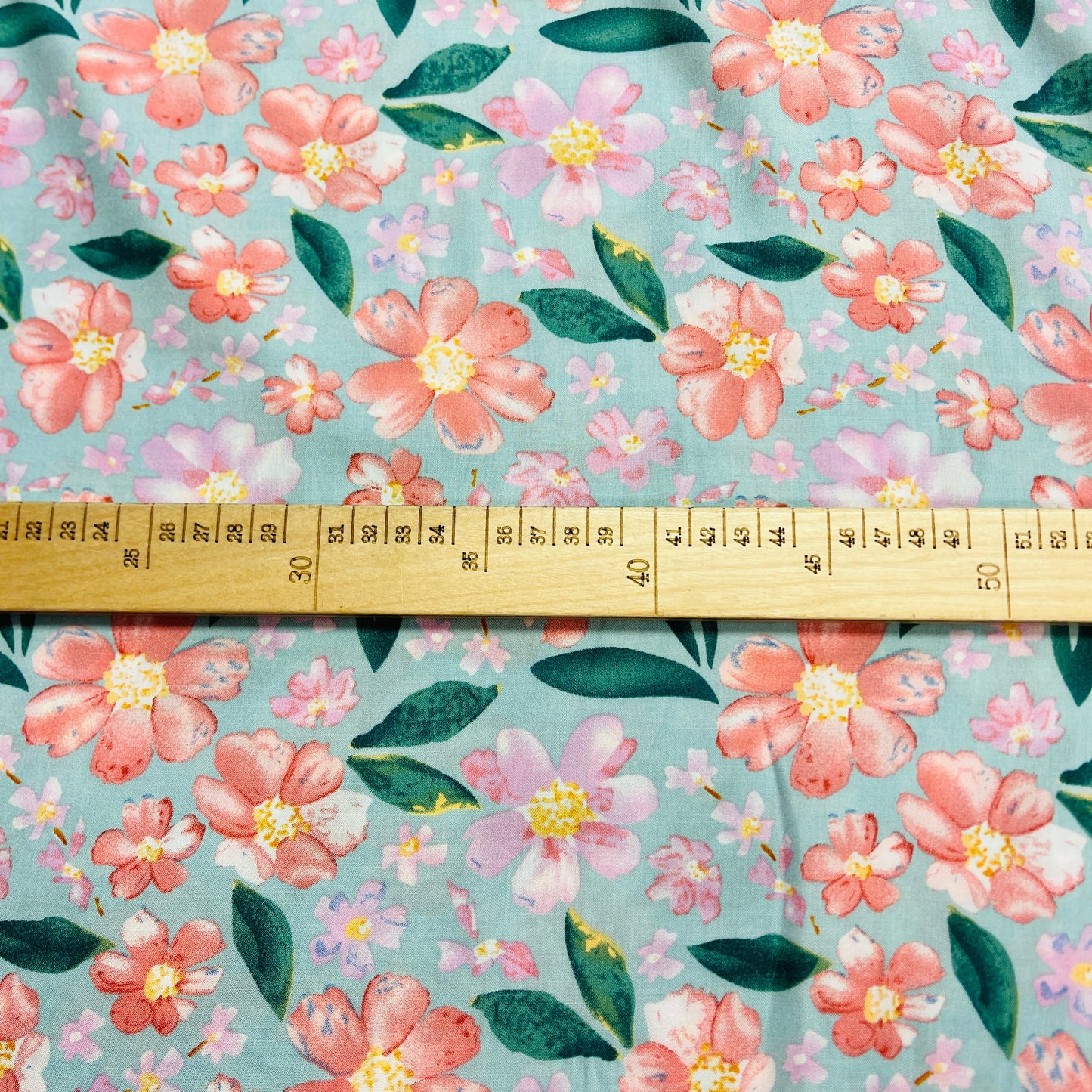 Image of 100% viscose fabric - flowers on a mint background 135 g/m² – available at Charlotte's Fabrics
