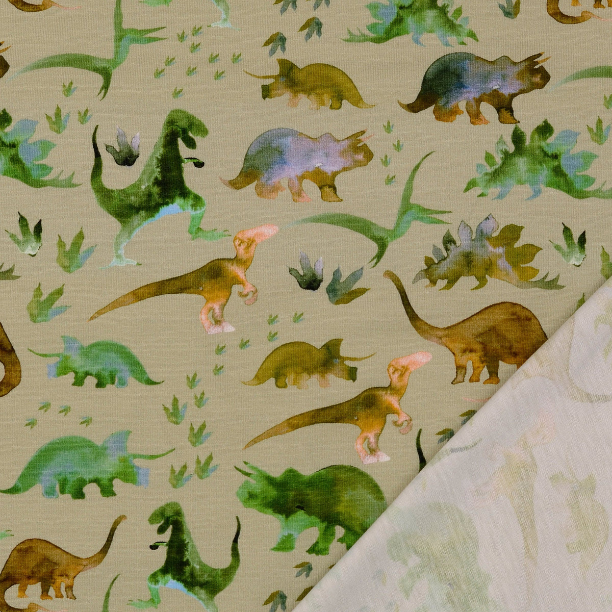 Image de tissu en tricot de coton avec dinosaures – disponible en ligne chez Šarlotes audumi