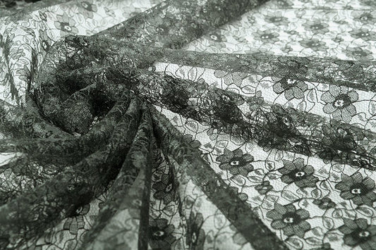 Tissu en dentelle fin - fleurs noires 75 g/m²
