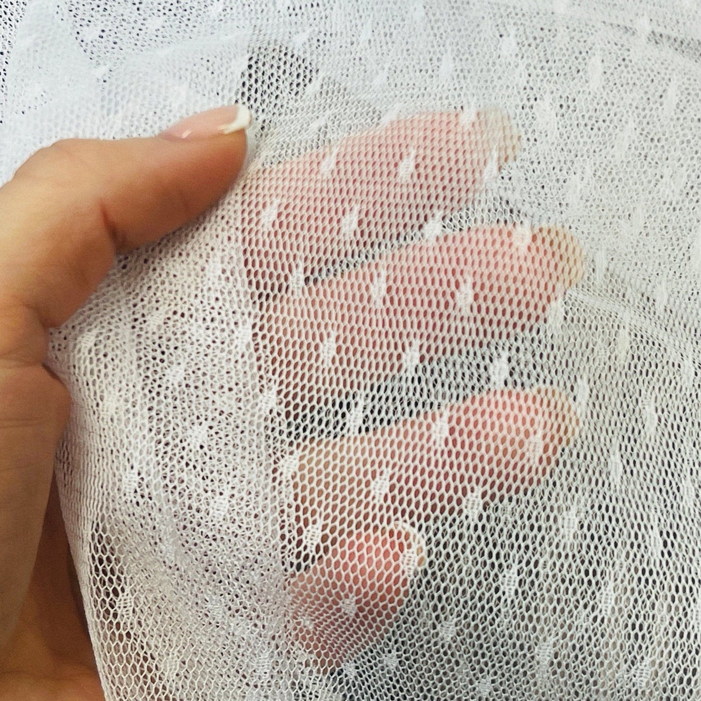 Tulle with small white pompoms