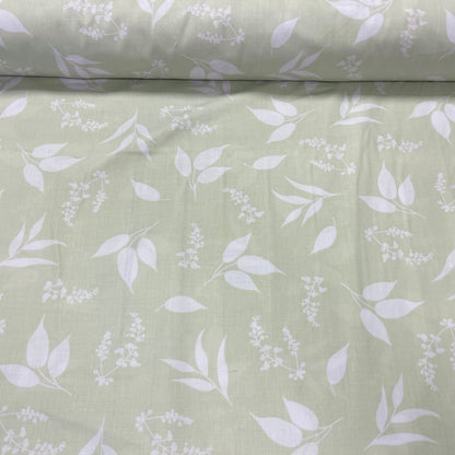 100% Cotton fabric - leaves on a soft green background 125 g/m²