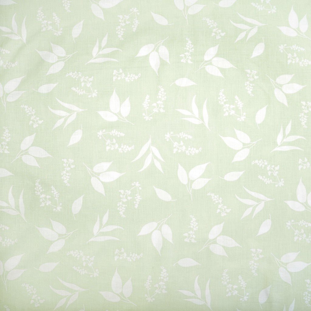 100% cotton fabric - leaves on a soft green background 125 g/m²