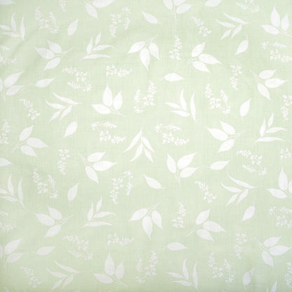 100% cotton fabric - leaves on a soft green background 125 g/m²