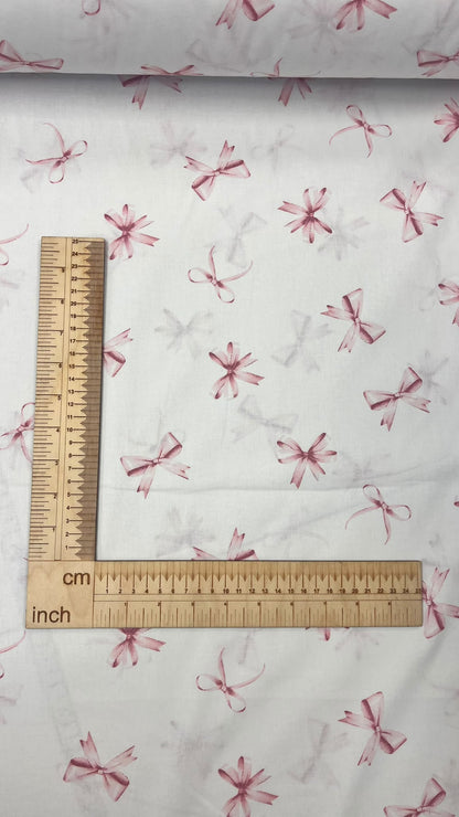 100% cotton fabric with pink bows – available online at Charlotte Fabrics