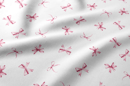 Image of 100% cotton fabric with pink ribbons – available online at Charlotte's Fabrics
