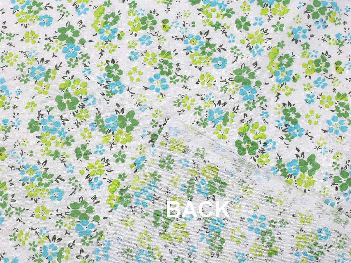Image en tissu 100 % coton à petites fleurs vertes délicates – disponible en ligne chez Šarlotes audumi