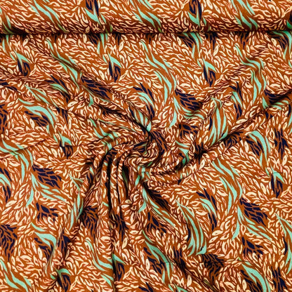 Tissu 100 % viscose brunâtre, motif menthe 125 g/m²