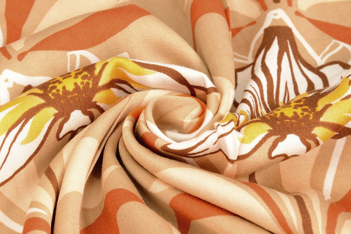Tissu 100 % viscose - fleurs orange 100 g/m²