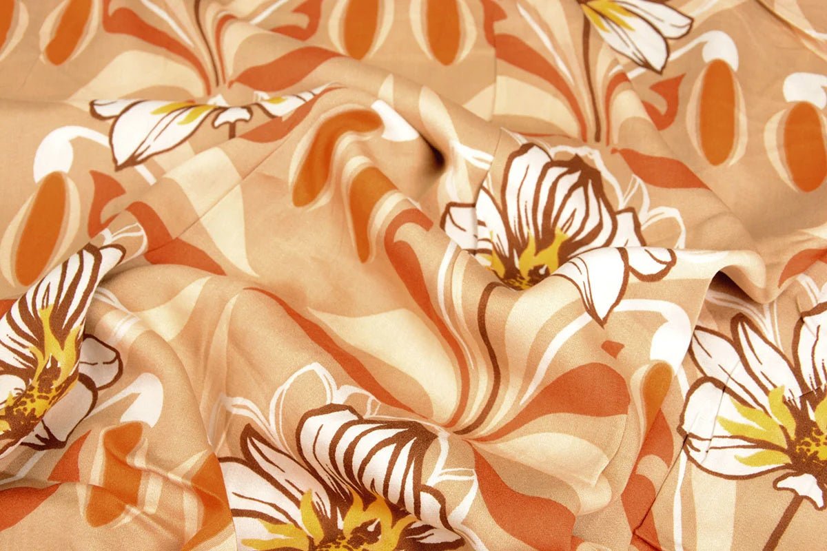 Tissu 100 % viscose - fleurs orange 100 g/m²
