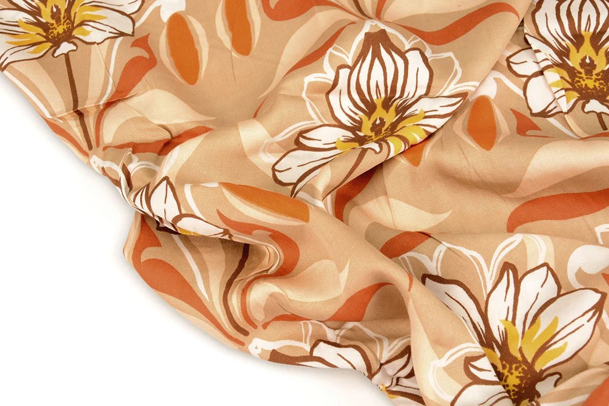 Tissu 100 % viscose - fleurs orange 100 g/m²
