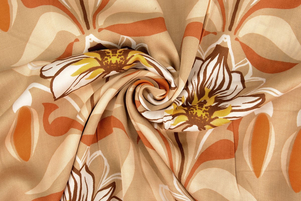 Tissu 100 % viscose - fleurs orange 100 g/m²