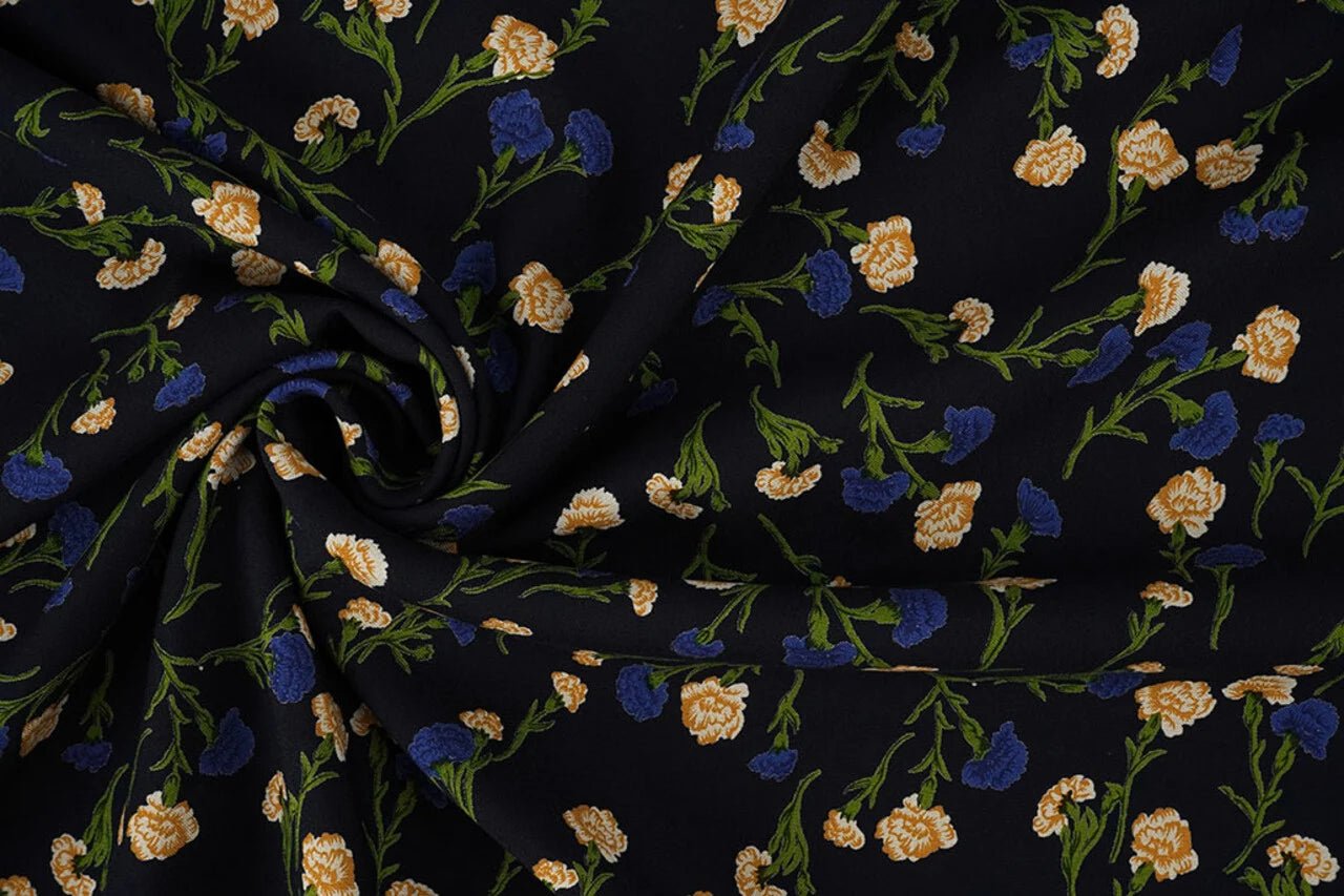 Image with 100% viscose fabric - delicate blue flowers 135 g/m² – available at Charlotte's fabrics