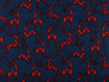 Flanelle de coton de Noël avec des rennes sur fond bleu