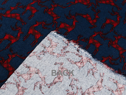 Flanelle de coton de Noël avec des rennes sur fond bleu
