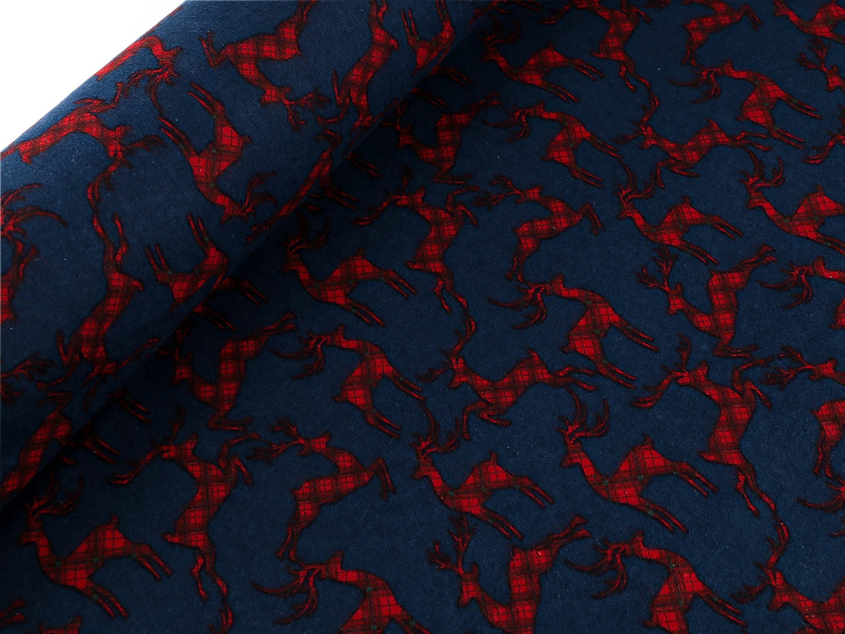 Flanelle de coton de Noël avec des rennes sur fond bleu