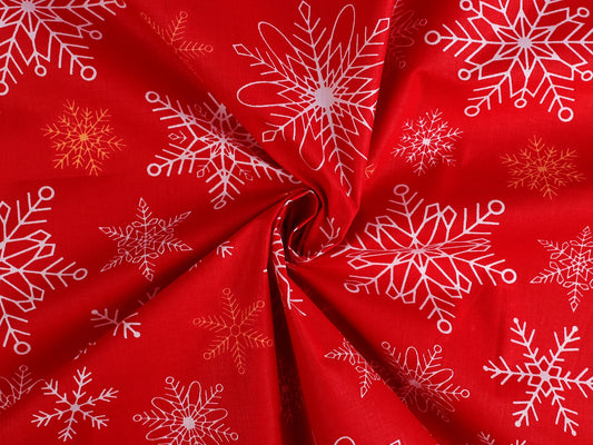 Tissu 100 % coton - flocons sur fond rouge