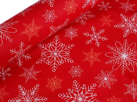 Tissu 100 % coton - flocons sur fond rouge