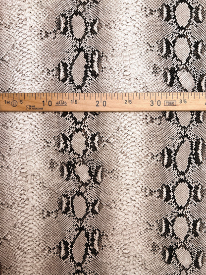 Viscose crepe fabric with snakeskin pattern in beige tones – Italy