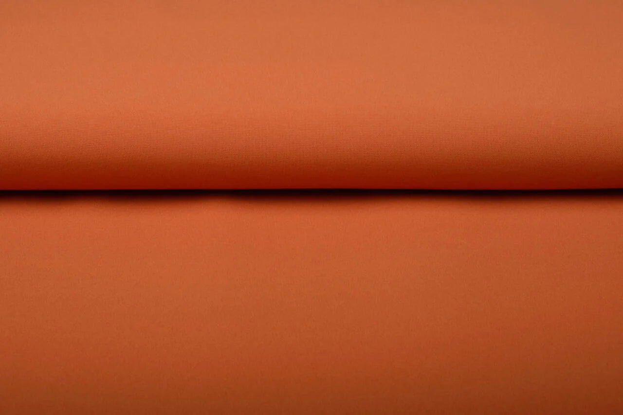 Image of orange gabardine available online at Charlotte's Fabrics