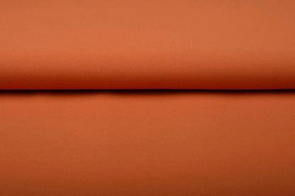 Image of orange gabardine available online at Charlotte's Fabrics