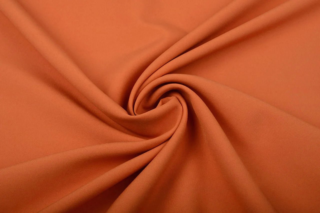 Image of orange gabardine – available online at Šarlotes audumi