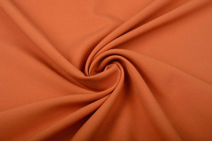 Image of orange gabardine – available online at Šarlotes audumi