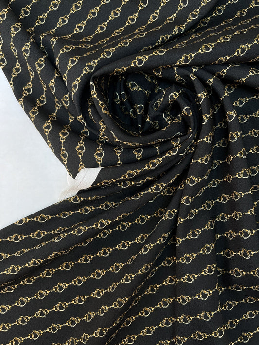 Image with Italian crepe fabric with chain pattern | Polyester 100% | 152 cm – available at Šarlotes audumi