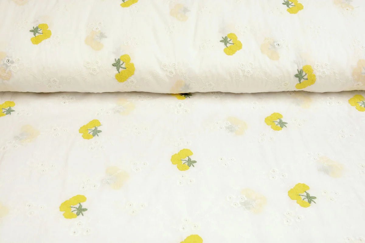 Tissu en coton brodé - fleurs jaunes 110 g/m²