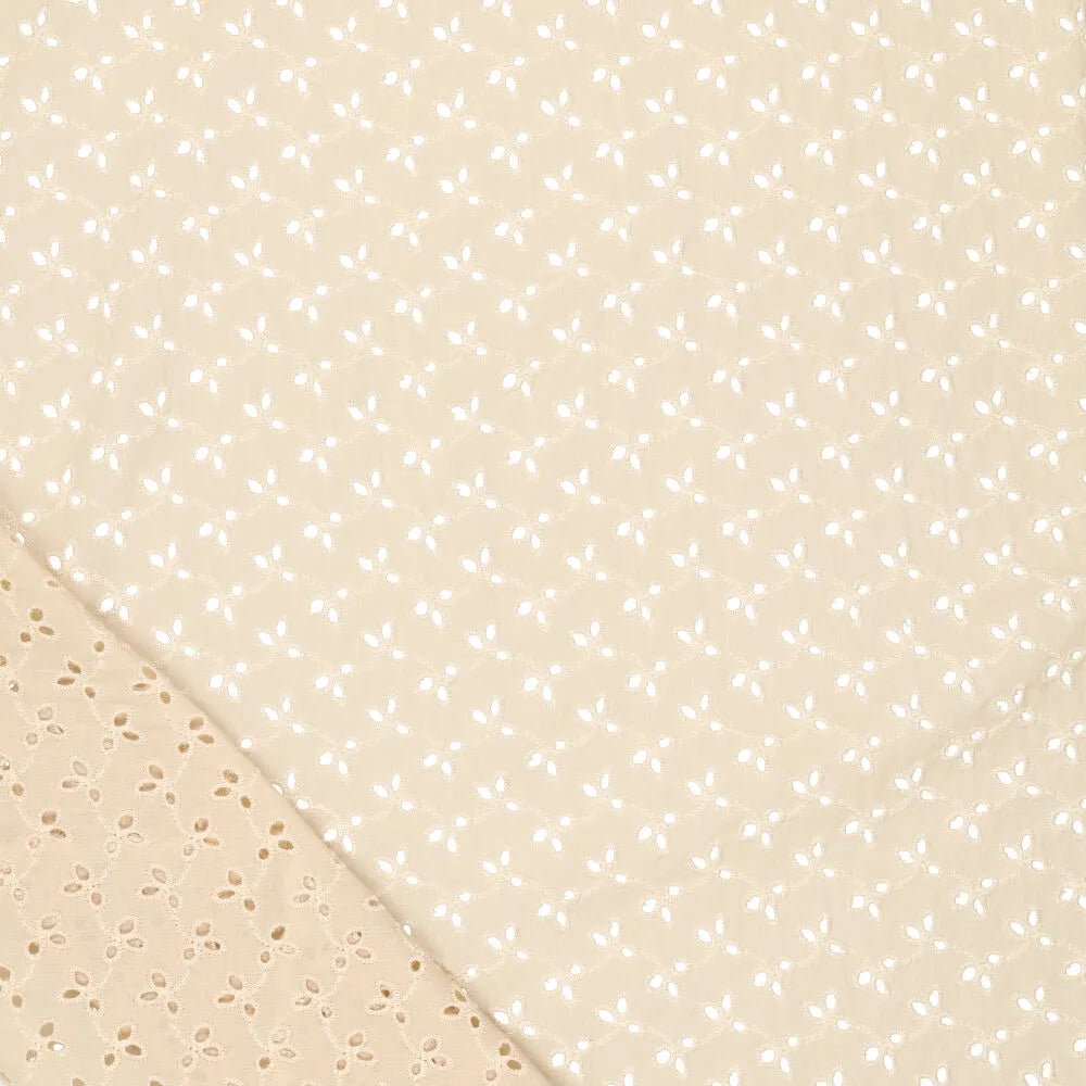 Tissu en coton brodé - broderie sur fond beige 115g/m²