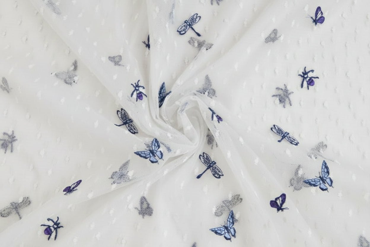 Image of embroidered tulle fabric with butterflies 100 g/m² – available at Šarlotes audumi