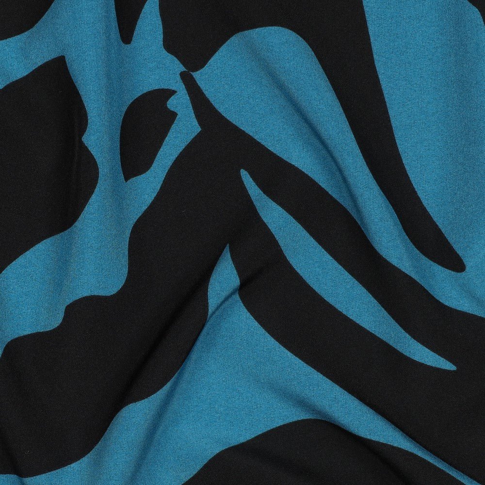 Tissu pour robe avec élasthanne, motif moucheté sur fond pétrole, 80 g/m² – disponible chez Tissus de Charlotte