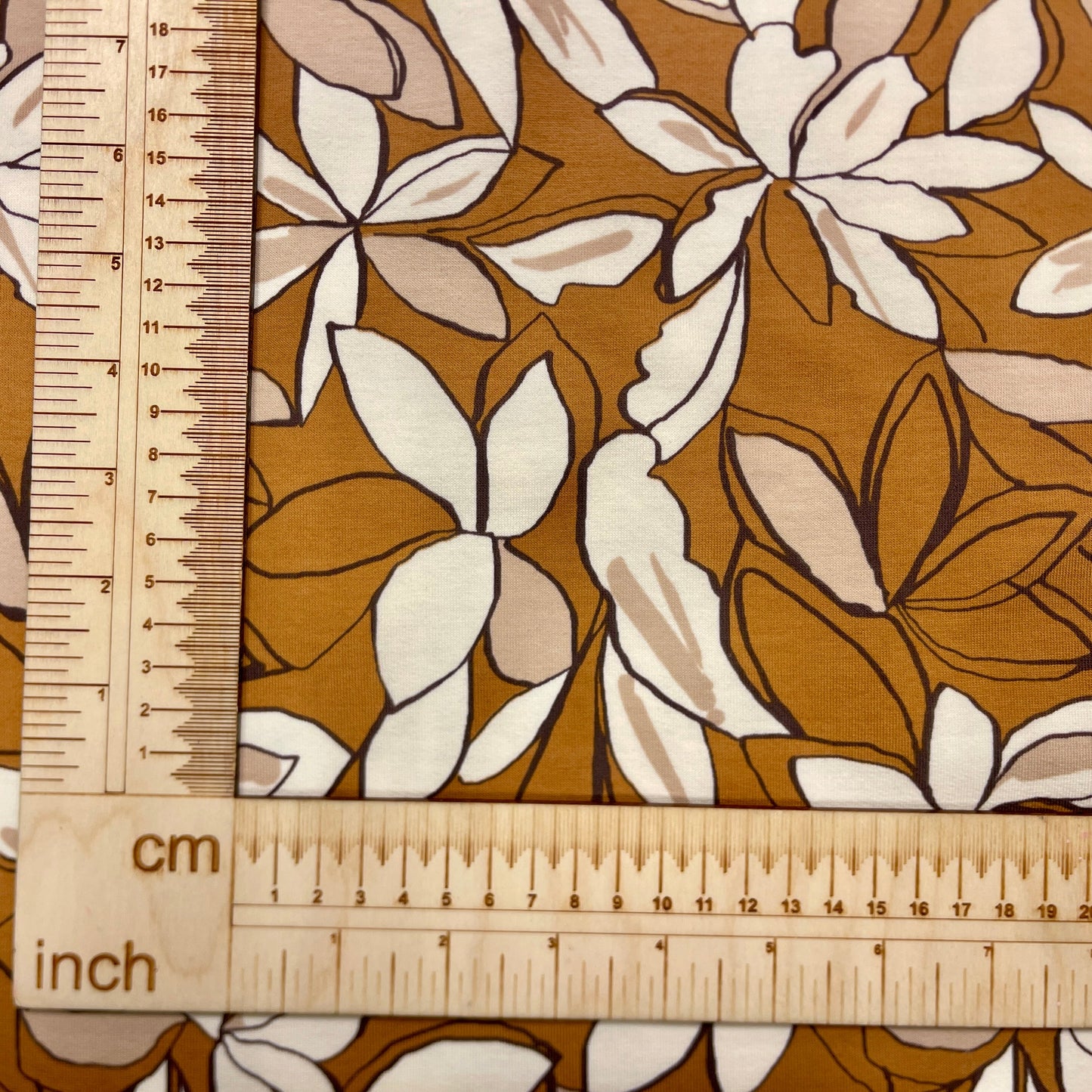 Cotton loopback jersey - flowers on a brown background 225 g/m²