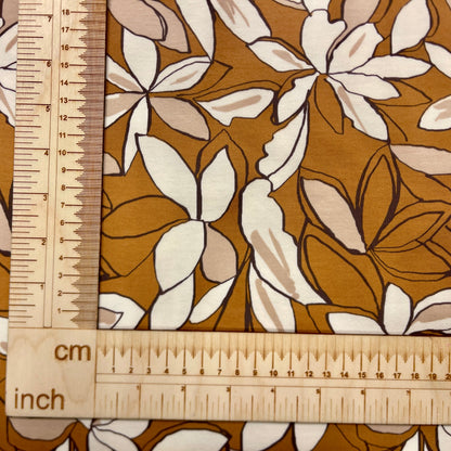 Cotton loopback jersey - flowers on a brown background 225 g/m²