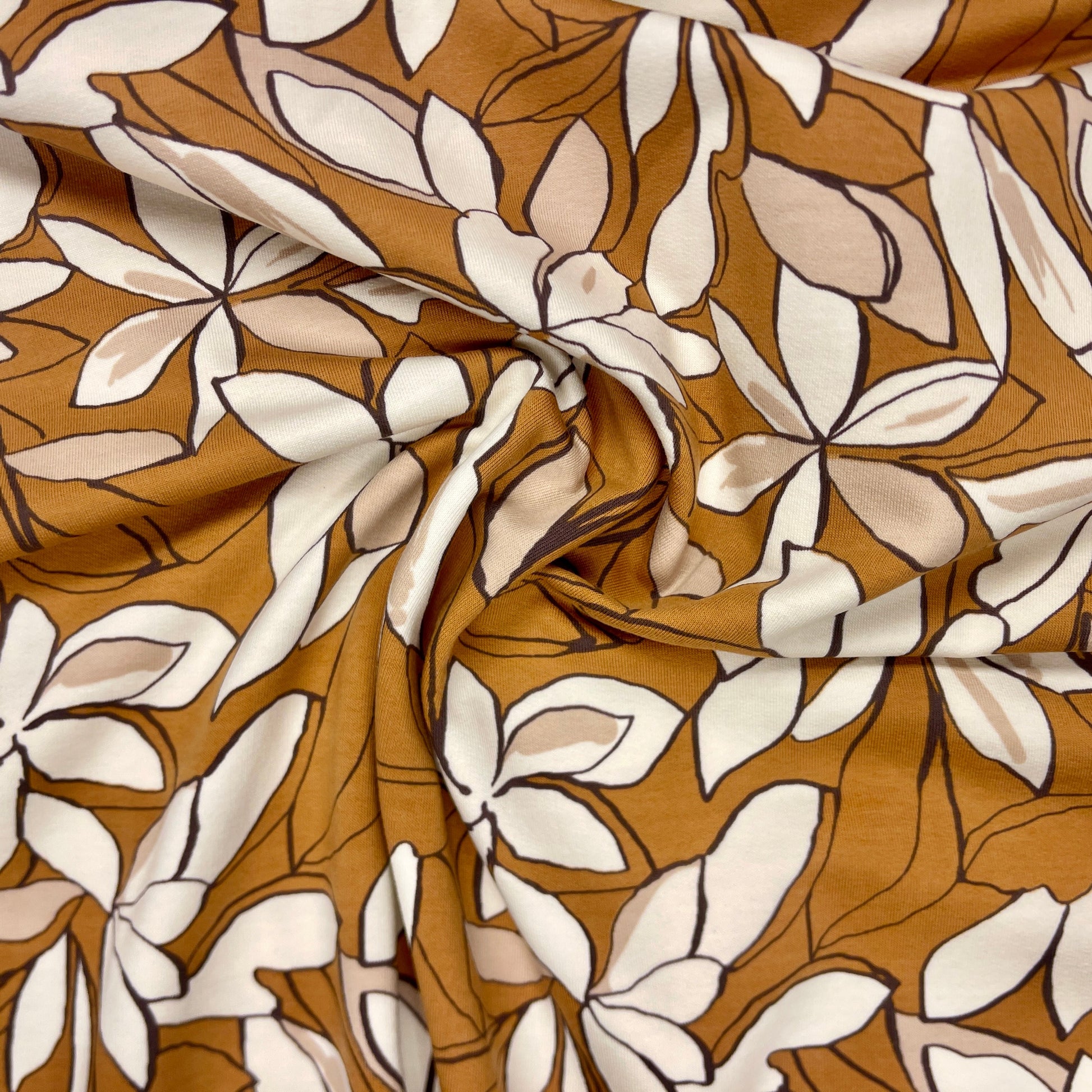 Cotton loopback knit - flowers on a brown background 225 g/m²