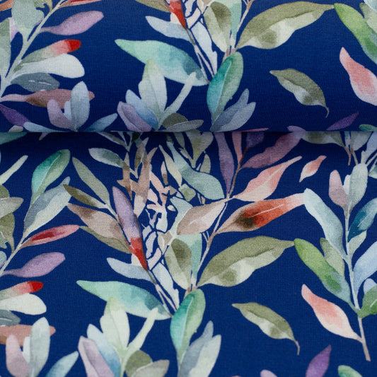 Jersey en coton - feuilles sur fond bleu 200 g/m²