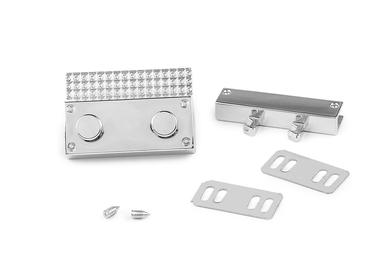 Image d’un fermoir métallique pour sac 27 × 41 mm – couleur argent – disponible en ligne chez Šarlotes audumi