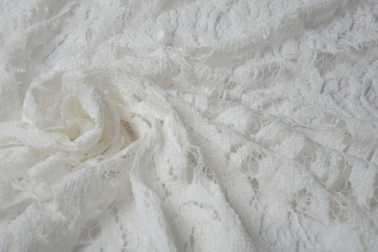 Tissu en dentelle - velours blanc crème 200 g/m²
