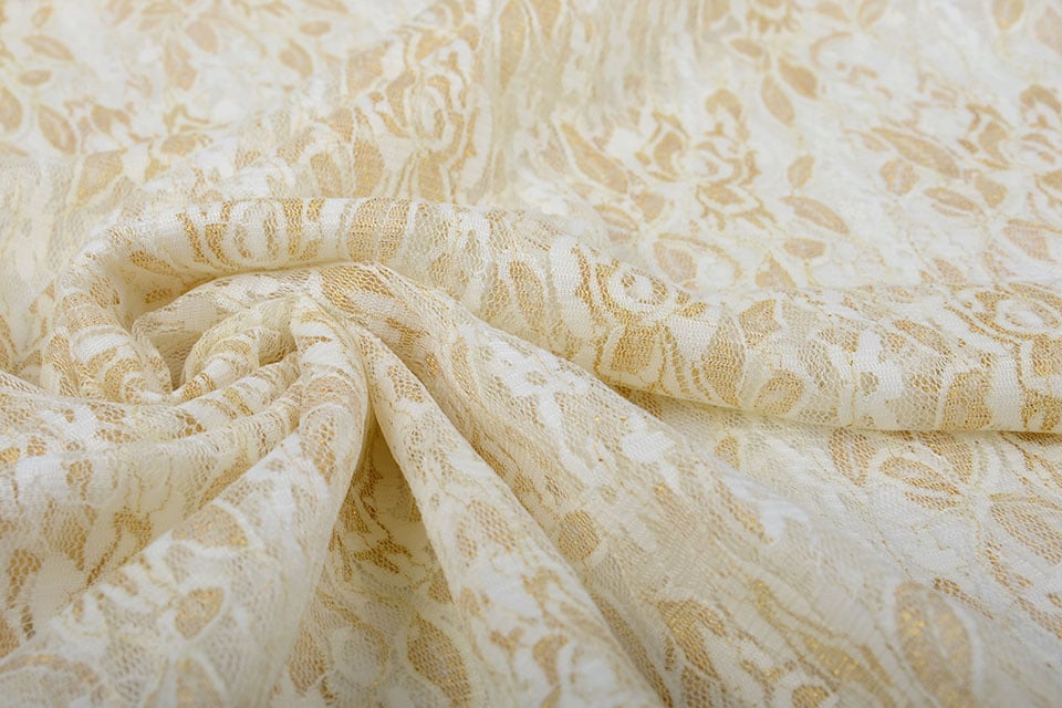 Delicate lace fabric with gold - black 90 g/m²