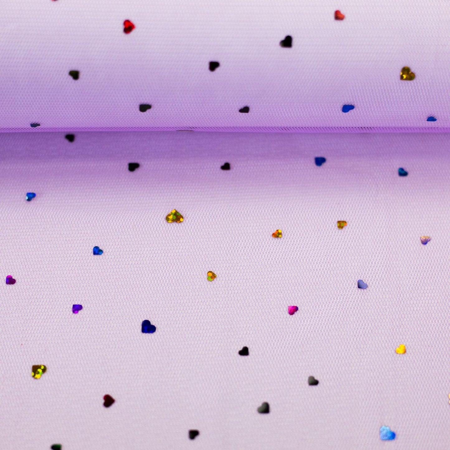 Image with soft tulle with hearts on a lilac background 40 g/m² – available at Šarlotes audumi
