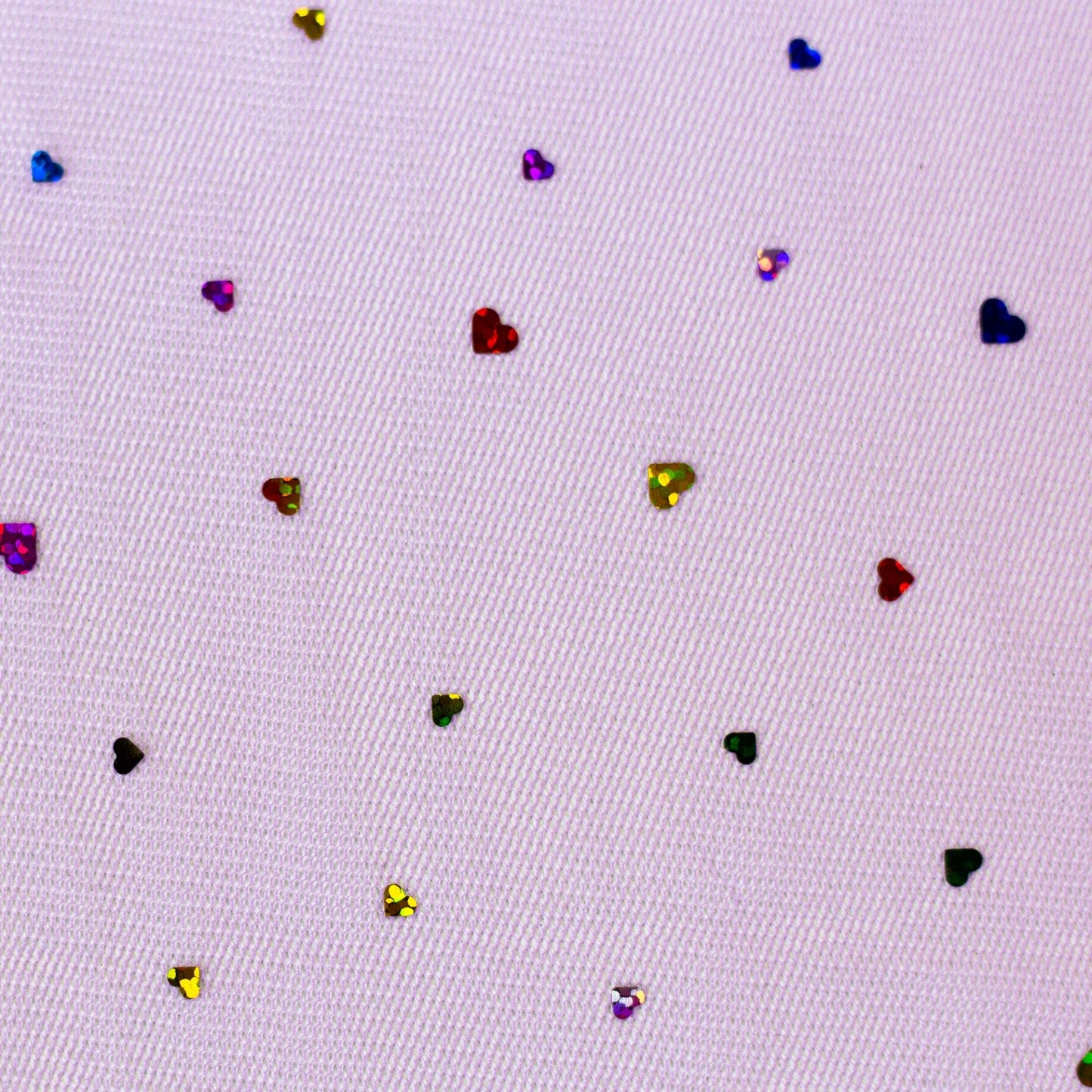 Image of soft tulle with hearts on a lilac background 40 g/m² – available at Šarlotes audumi