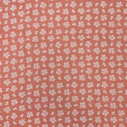 muslin - white flowers on an orange background 130 g/m²