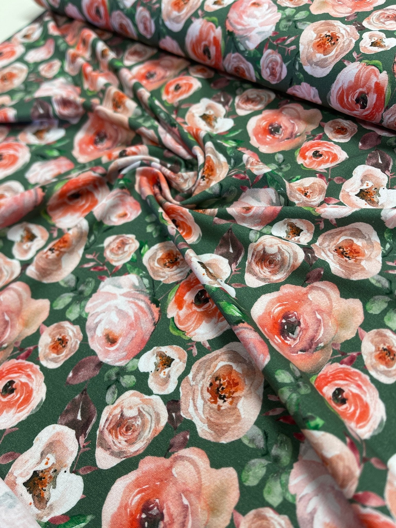 Lightweight cotton jersey - roses on a green background 200 g/m²