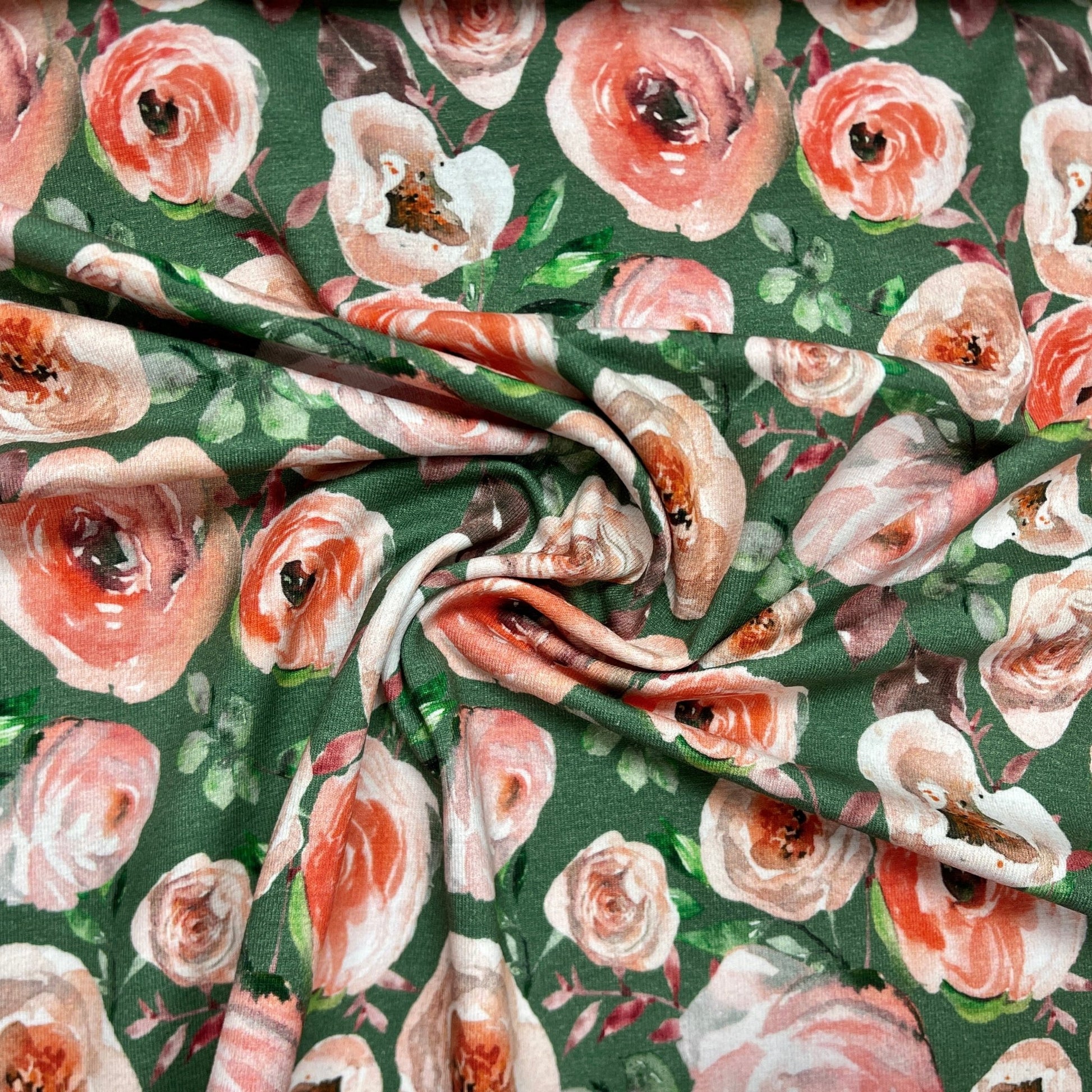 alt
Thin cotton jersey - roses on a green background 200 g/m²