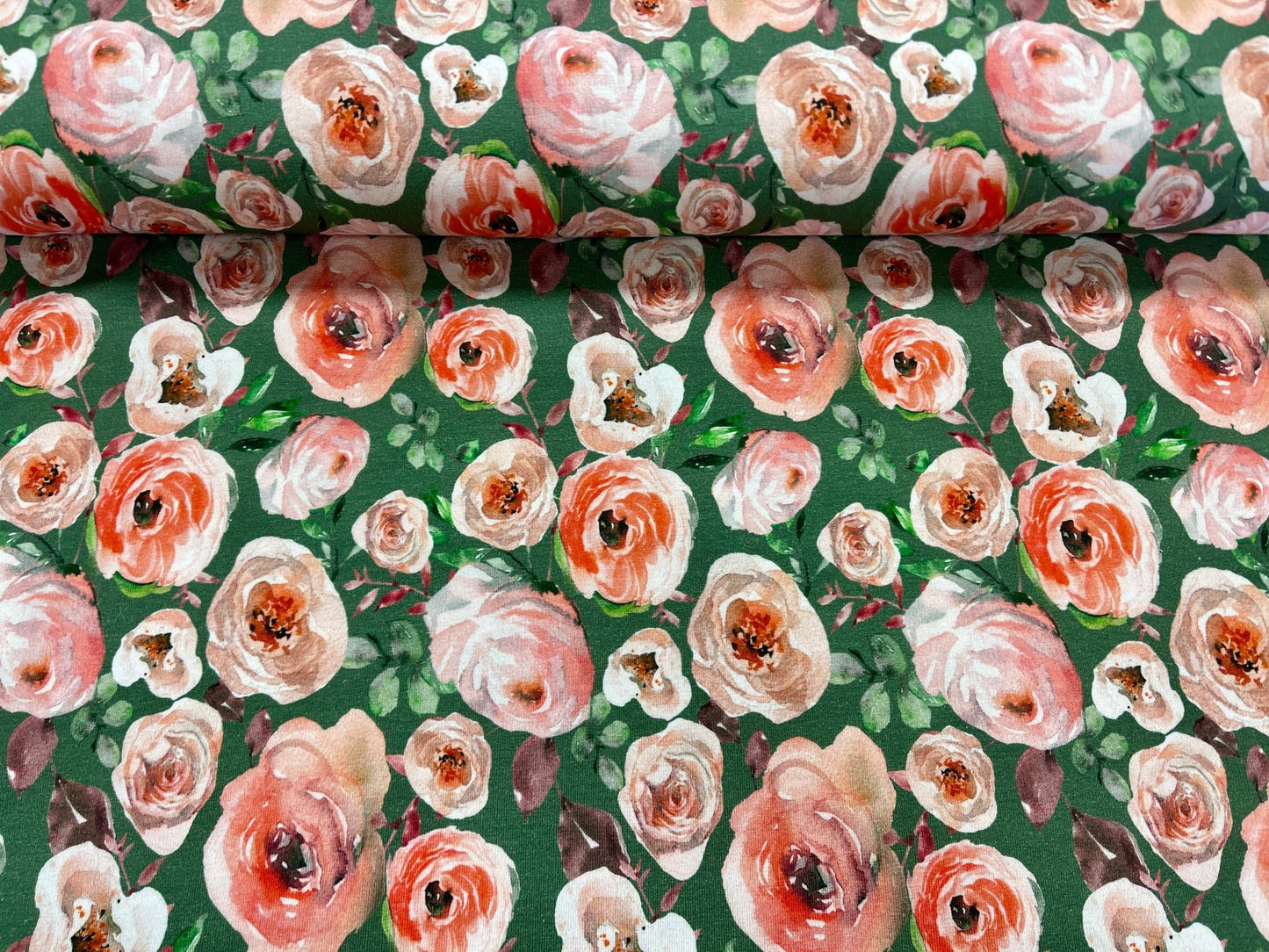 alt
Thin cotton jersey - roses on a green background 200 g/m²