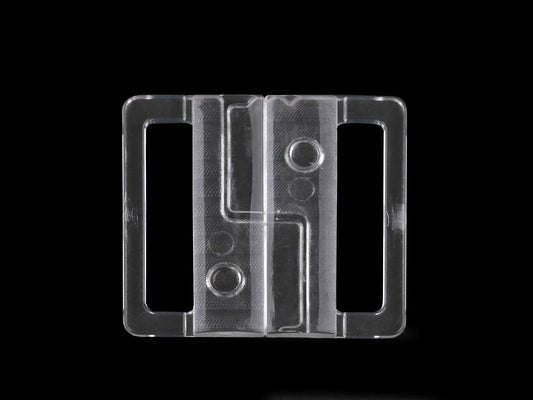 Image avec fermoir en plastique pour maillots de bain et soutiens-gorge, 30 mm – transparent – disponible en ligne chez Tissus Charlotte