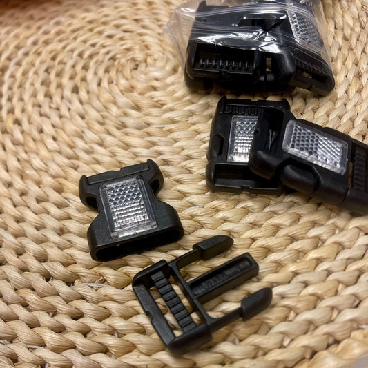 Image with plastic buckle with reflector 25 mm - (10 pcs per pack) – available at Šarlotes audumi