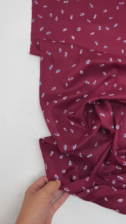 Italian twill fabric in burgundy with a subtle pattern 125 g/m²