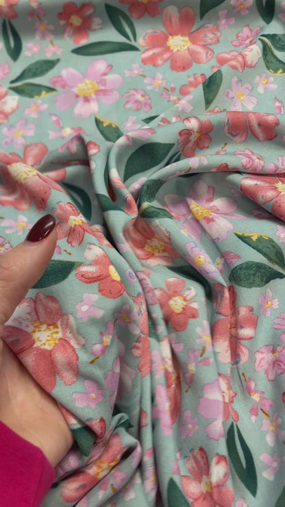 100% Viscose fabric - flowers on mint background 135 g/m²